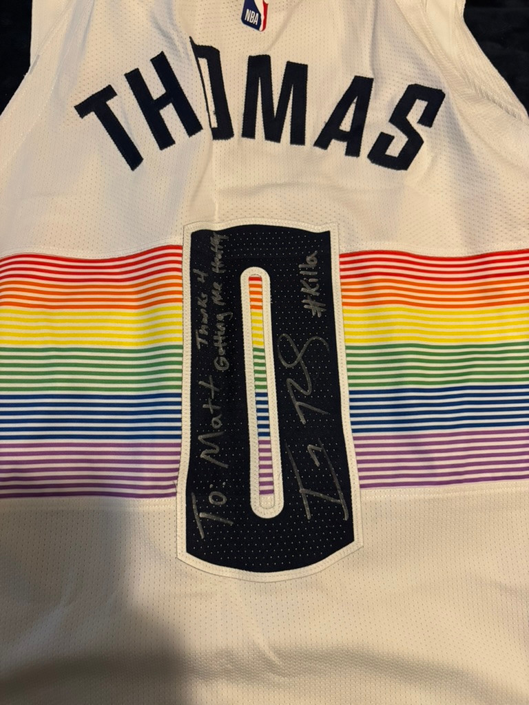 Thomas number 0 rainbow basketball jersey from Matt’s collection, with original inscriptions.